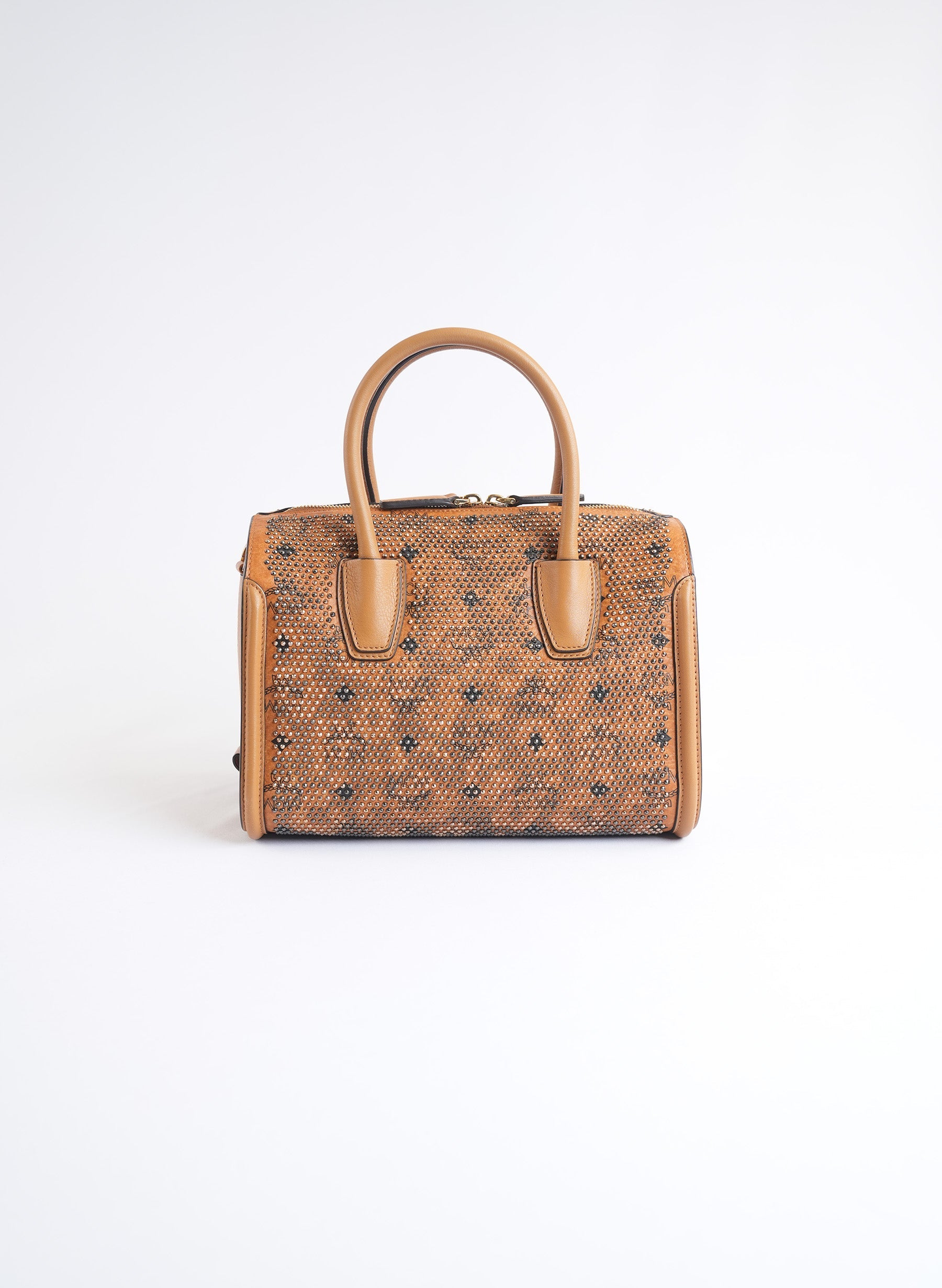 Sac à main clouté en toile enduite MCM