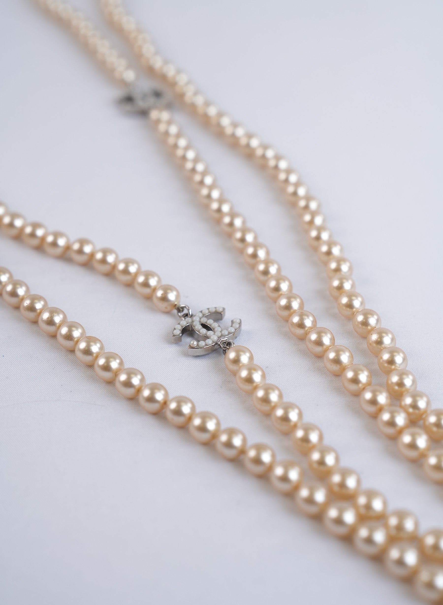 Chanel Long Faux Pearl Necklace With CC Logo Charms