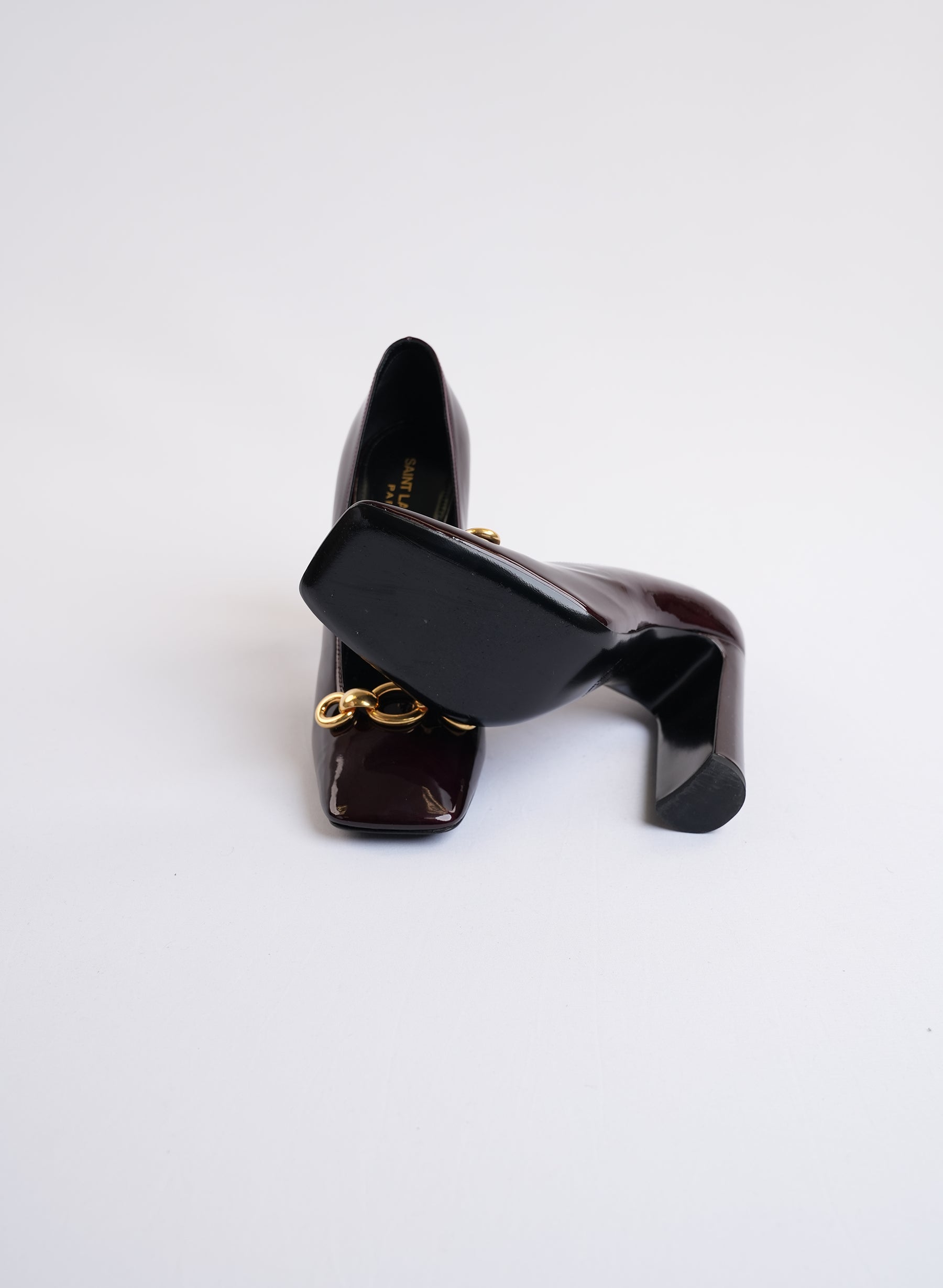 Saint Laurent Burgundy Patent Leather Pumps With Gold-Tone Hardware