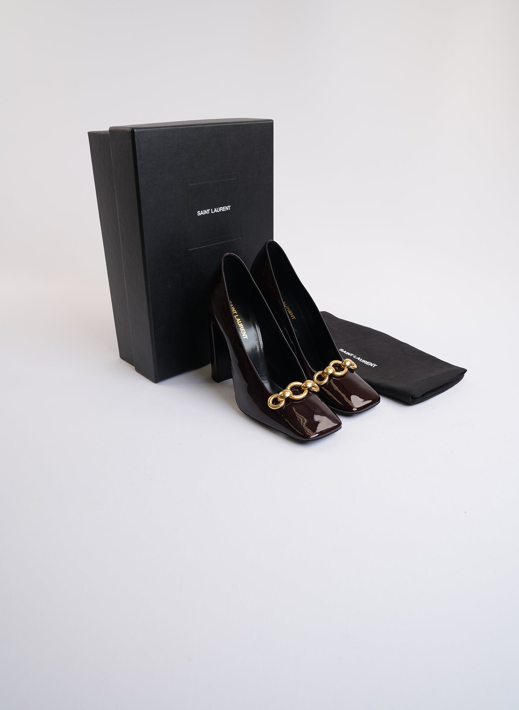 Saint Laurent Burgundy Patent Leather Pumps With Gold-Tone Hardware